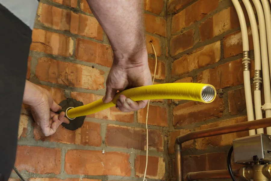 A long continuous run of Flexigas yellow corrugated gas pipe